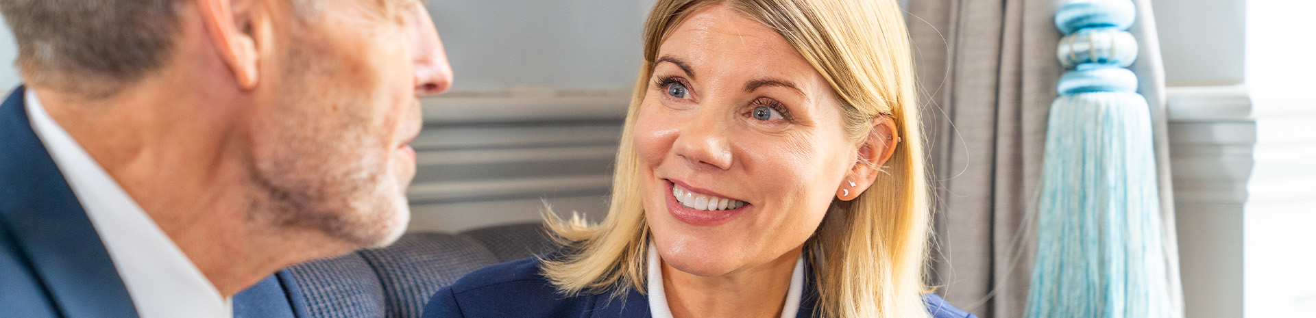 Two colleagues smiling during meeting